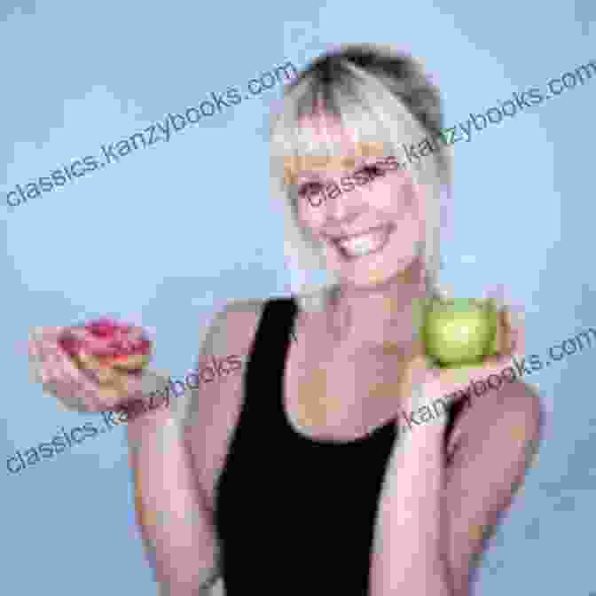 Caroline Fibæk, The Author Of Raw Cakes, Smiling While Holding A Cake Raw Cakes Caroline Fibaek